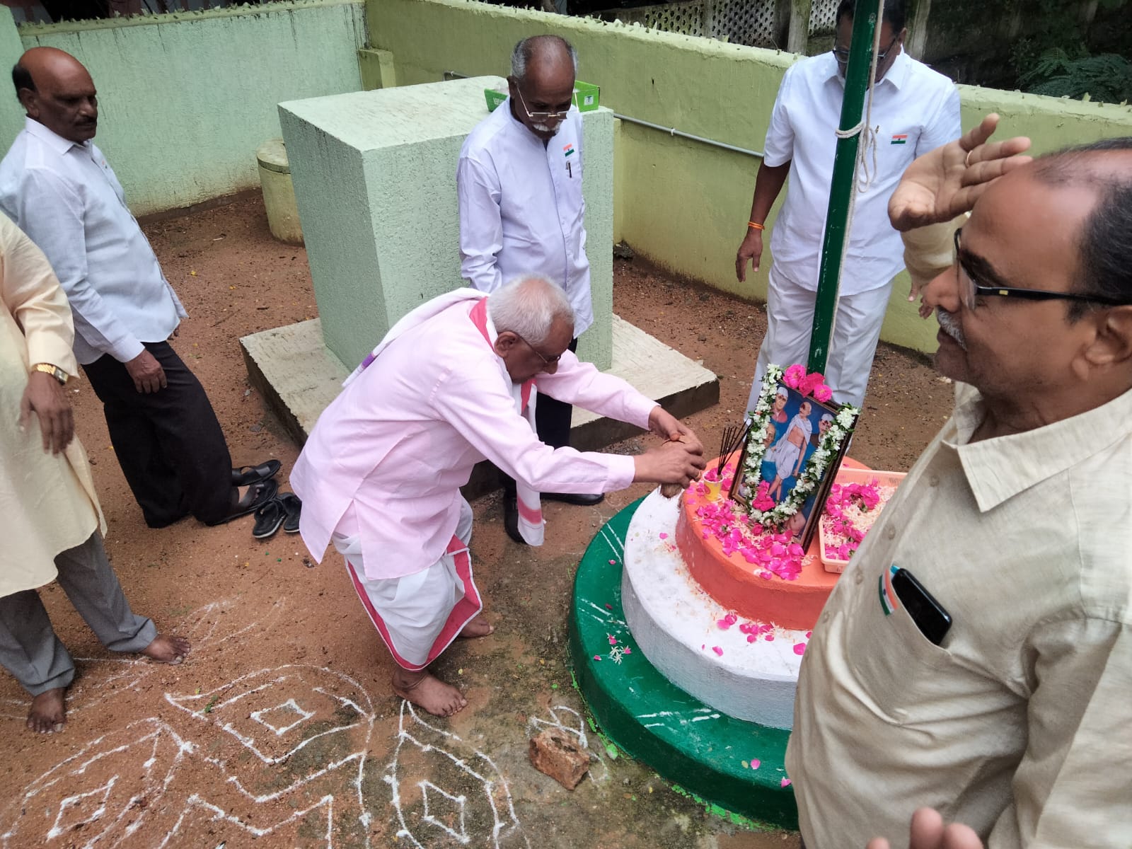 Senior most member K. Krishna Murty garu initiating the celebrations by breaking the coconut .jpg
